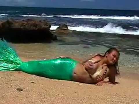 Sexy Mermaid girl in The sun in hawaii on the beach Sexy Mermaid girl in The sun in hawaii on the beach