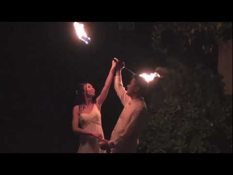 Hawaii wedding video teaser , newlyweds with a fire dancer at their oahu reception